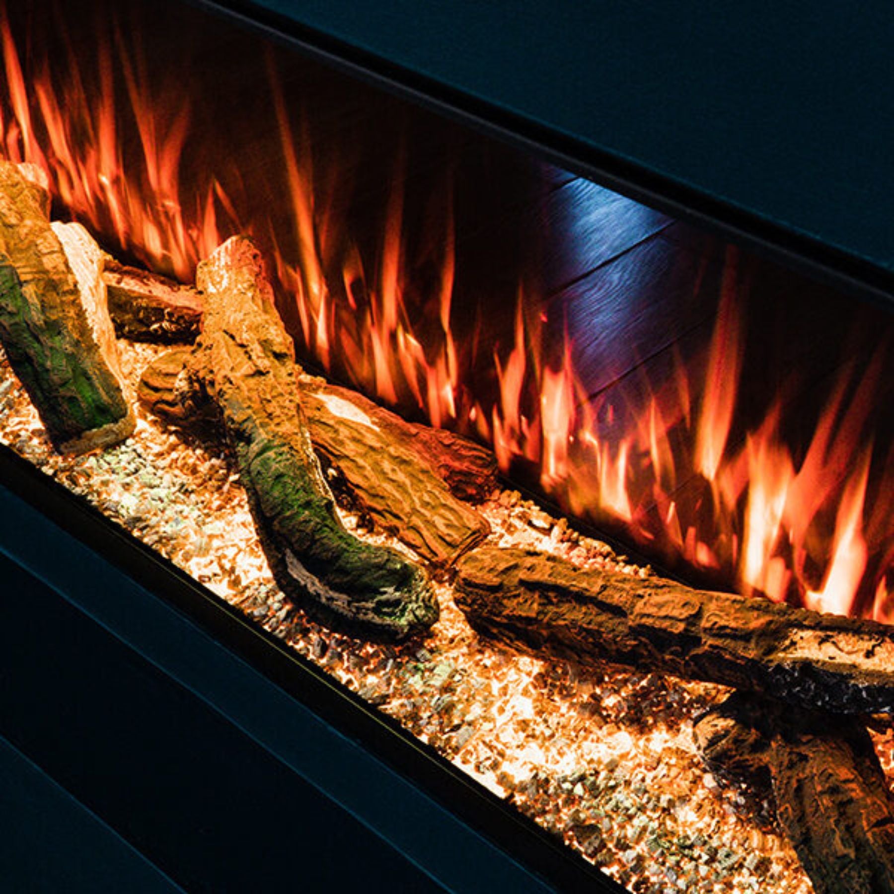 Econovex E1270 50 Inch 3 Sided Panoramic Electric Fire showing realistic logs and flames